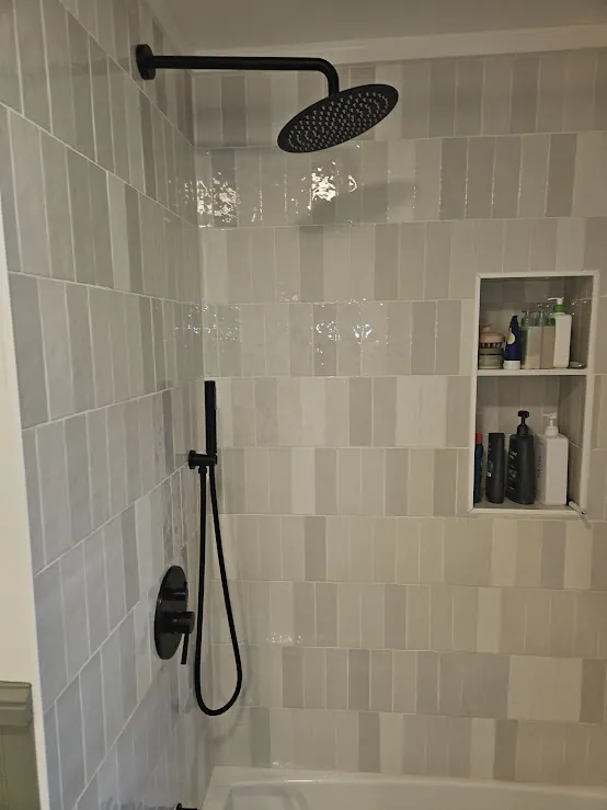 Tile shower with matte black fixtures