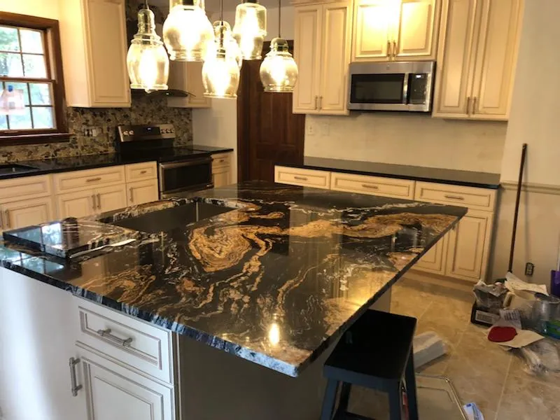 Kitchen island with dramatic black and gold granite