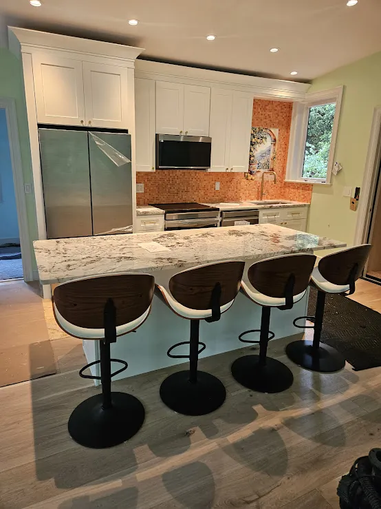 Granite island with modern bar stools