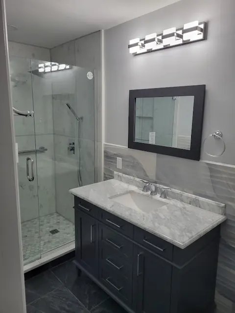 Navy bathroom vanity with marble top