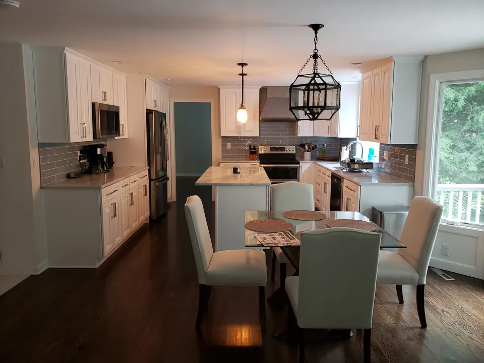 White kitchen open to dining area