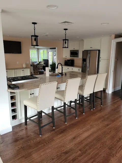 White kitchen with large island seating five
